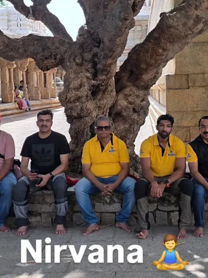 A moment of peace with the riding crew under a very old tree within the Lepakshi temple complex.
