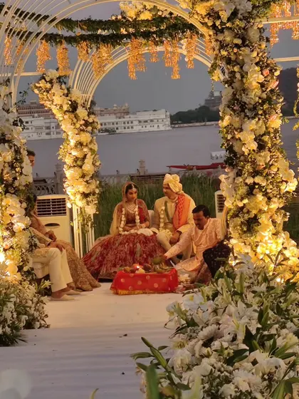 A serene moment from the pheras at a lakeside wedding in Udaipur. While we are known for dance, we are involved in the entire celebration to ensure every moment is perfect.