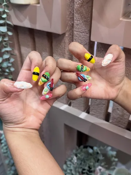 The complete sushi set against our studio's calming backdrop. Fun, quirky, and expertly crafted 3D nail art is what we do best.