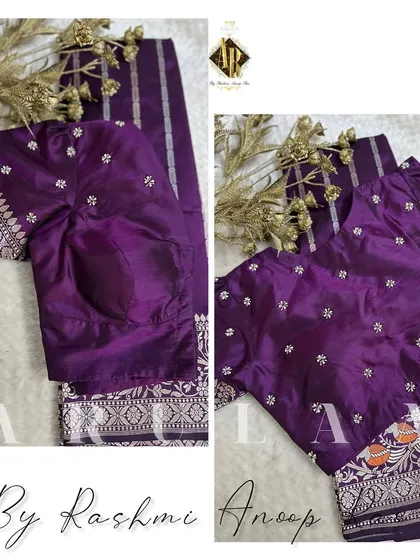 A purple blouse with delicate silver butis, designed to be paired with a saree that has a silver zari border.