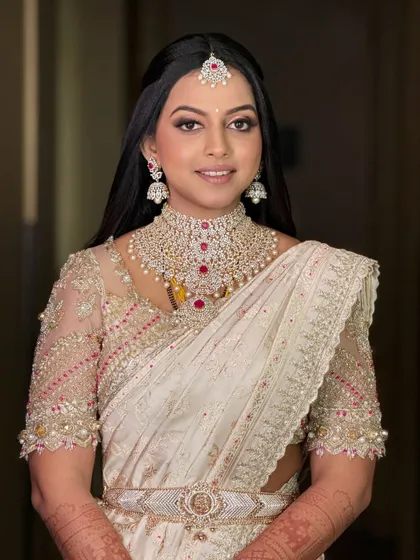 Another beautiful shot of the bride. The intricate details of her diamond jewelry and the embroidery on her blouse are simply stunning.
