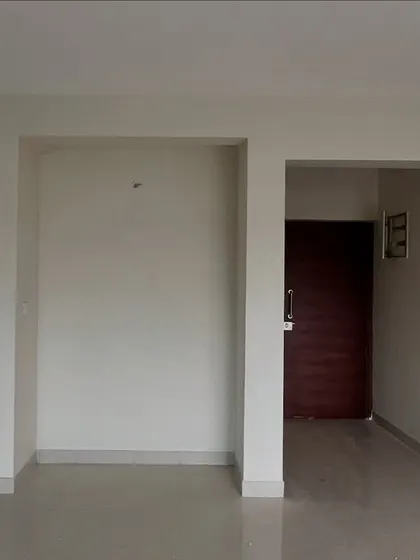 An empty foyer space before any interior work has begun.