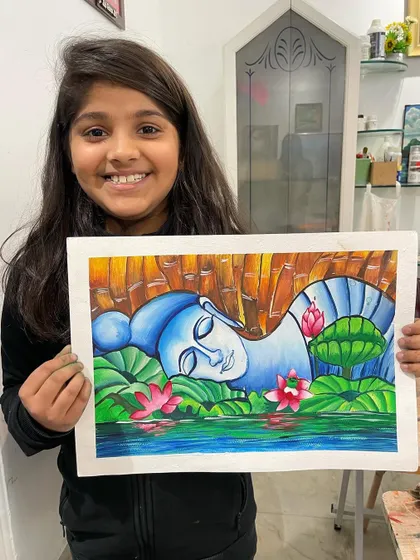 Look at the serene expression on this Buddha painting, created by a 10-year-old student. We learn to use color and composition to evoke a sense of peace and tranquility in our art.