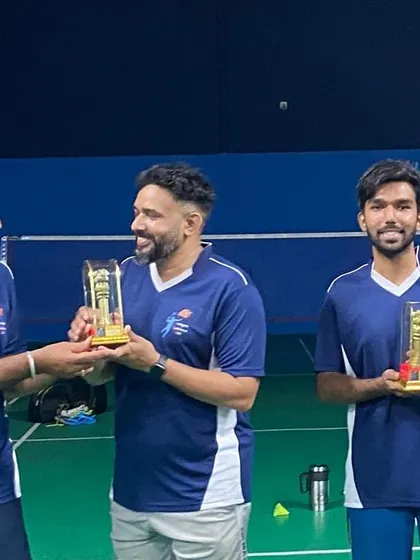 Teammates sharing a laugh while receiving their awards.