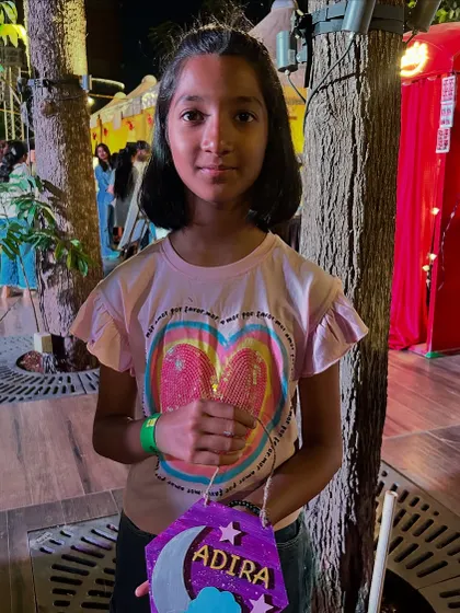 A participant with her personalized lantern, perfect for adding a handmade touch to her room.