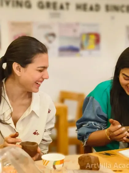 Two participants share a laugh during our pottery date workshop. These events are designed to be relaxed, fun, and a great way to spend quality time together.