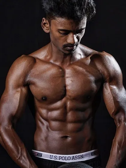 A powerful shot from a client's photoshoot, highlighting the chest and abdominal muscles he built.
