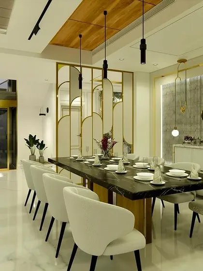 A similar view of the dining space, showing its connection to the lobby and staircase area.