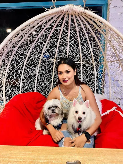 Posing for the camera on her birthday! It's a joy to see families, including their furry members, come together to celebrate milestones at Bark Street.