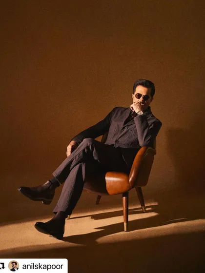 A moody, stylish shot of Anil Kapoor. The hair is styled with a bit of texture for a more modern feel.