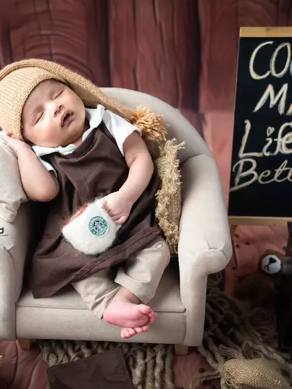 Our tiny barista taking a nap in his armchair after a long day of making coffee.