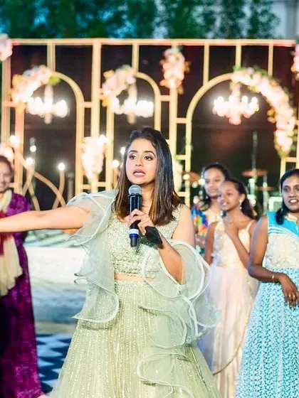 As the emcee, I love engaging with the crowd and making everyone feel part of the celebration. Here I am, interacting with the guests during the birthday party.