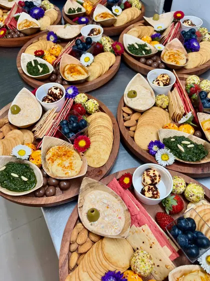 A collection of our individual cheese and dips platters, prepared for a corporate event. Each platter is a perfect single-serving graze, beautifully arranged with a variety of textures and flavours.