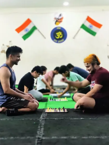 Training the mind is as important as training the body. Our students engage in a game of chess after a tough physical workout to sharpen their strategic thinking.