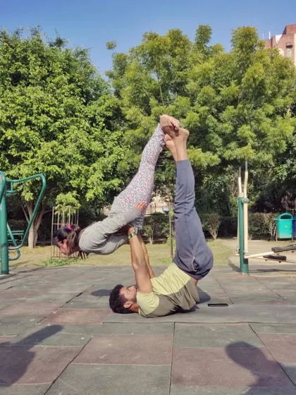 Acro yoga is a fantastic way to build strength and trust with a partner. This pose requires core stability from both the base and the flyer, and it’s a fun challenge we can work towards in my partner sessions.