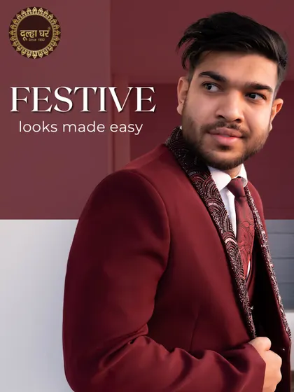 Festive looks made easy. A model in a deep maroon three-piece suit with an embellished lapel, perfect for a winter wedding reception.