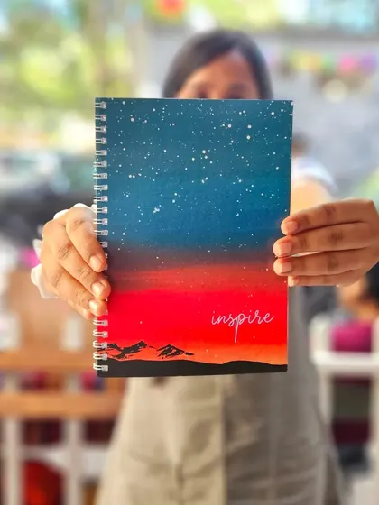 A shot of my 'Inspire' notebook from one of my market stalls. It's so rewarding to see my hand-painted designs come to life as functional stationery.
