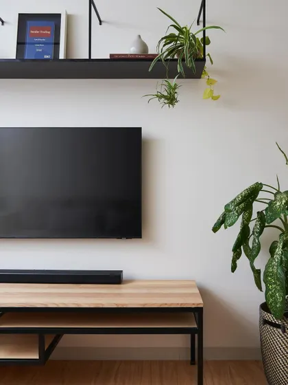 This simple yet elegant TV console in the Zen House is crafted from ash wood with a black steel frame. It reflects my minimalist approach, where every piece is designed with clean lines and a focus on material honesty.