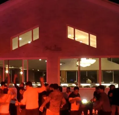 Another shot of the Godrej party with dramatic red lighting.