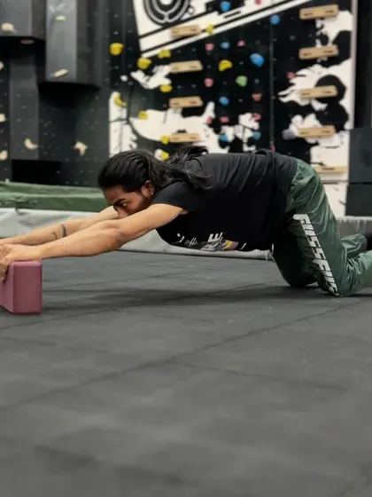 A demonstration of a child's pose single-arm extension, another great drill for thoracic mobility. These exercises help undo the effects of sitting at a desk all day.