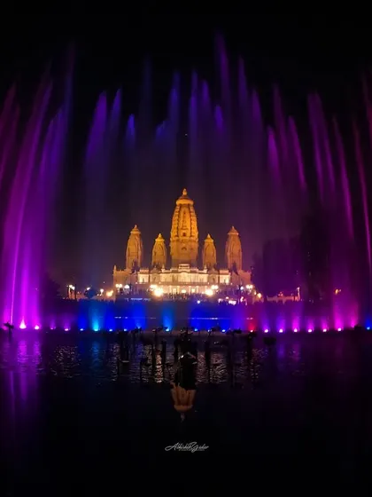 The spectacular musical fountain show at JK Temple in Kanpur. This long-exposure shot captures the vibrant colors of the fountains against the beautifully lit temple.