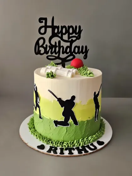 The cricket fever! A 1kg chocolate mousse cake for Rithu, decorated with cricket player silhouettes and a bat and ball.