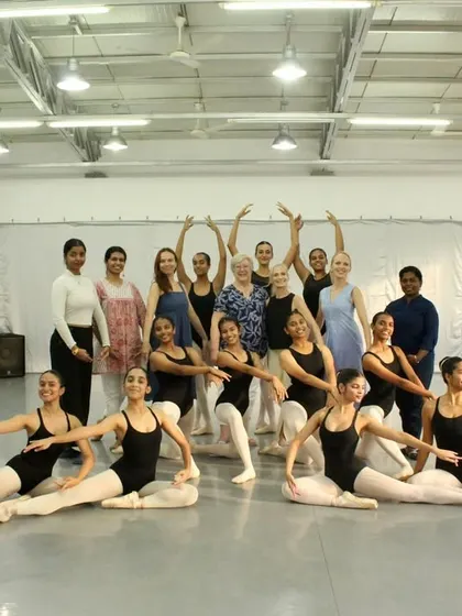 A group photo celebrating the successful completion of ISTD exams, with students, teachers, and the official ISTD examiner.