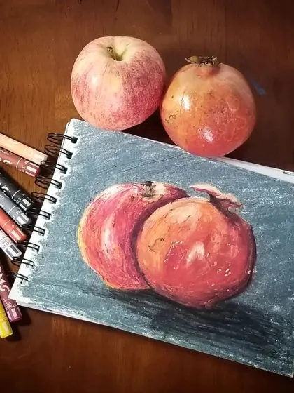 A still life study comparing the real fruit to the oil pastel drawing. This is a great exercise for practicing how to see and replicate colors, light, and shadows from life.