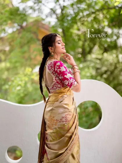 A side view of this stunning pink and gold bridal look. The elegant design and rich colors make it a perfect choice for a pre-wedding function.
