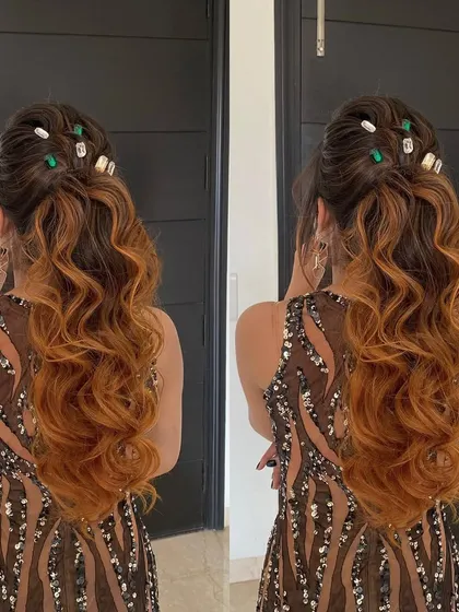 A messy ponytail with a twist. The colorful stone clips add a playful, modern vibe to this textured look, while extensions give the ponytail its impressive volume.