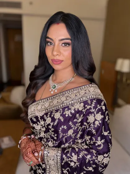 Another angle of this timeless look, showing the beautiful details of the saree and the flawless makeup.
