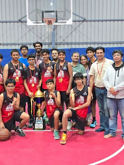 The champion Pitch Hawks team with their parents and supporters, sharing the joy of winning the Youth League Season 2 trophy.