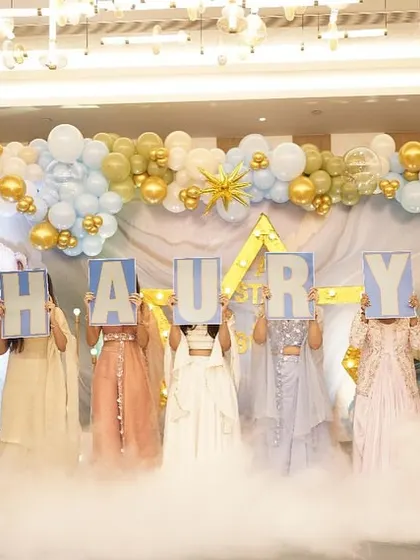 A dramatic name reveal with dry ice creating a cloud effect at the family's feet.