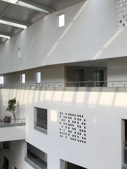 The upper levels of the atrium at Parkside Retirement Homes. The open corridors and visual links between floors create a lively atmosphere, allowing residents to feel connected to the community's activities from their own level.