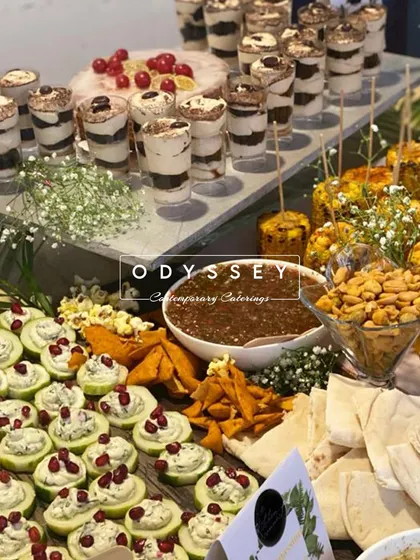 This section of a grazing table highlights our stuffed cucumber bites and mini dessert cups. We focus on creating a visual rhythm with colors, shapes, and textures across the entire spread.