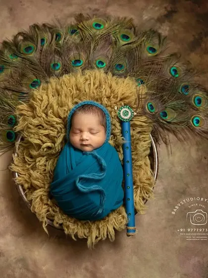Another angle of the classic swaddled Krishna pose, this time showing a wider view of the textured backdrop and the carefully placed flute.