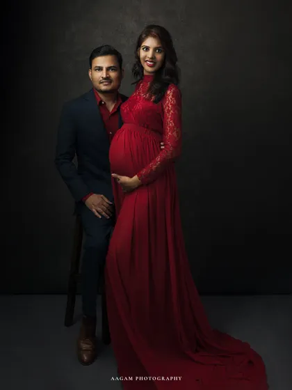 A classic and poised fine art maternity portrait. The couple stands together, creating a powerful image of unity and strength as they await their new arrival.