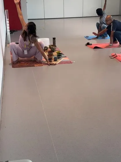 A squat variation (Malasana) to open the hips. I encourage modifications to make poses like this accessible for everyone in a corporate setting.