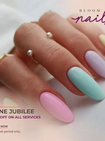 A lovely set of solid pastel nails in pink, mint, lilac, and yellow. A perfect way to wear multiple colors.
