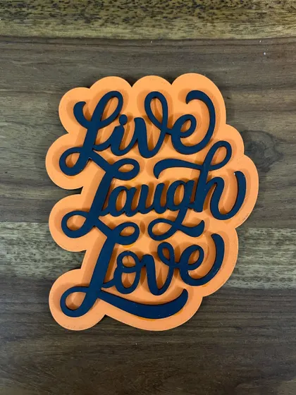 A daily reminder to "Live Laugh Love." This handcrafted fridge magnet is all about spreading positivity and good vibes.