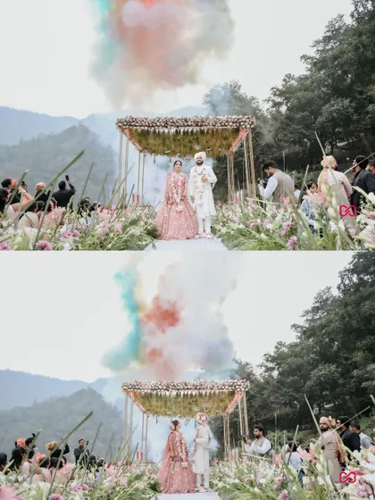 A breathtaking wide shot of a destination wedding in the mountains, with the couple at the mandap and color smoke creating a magical effect.