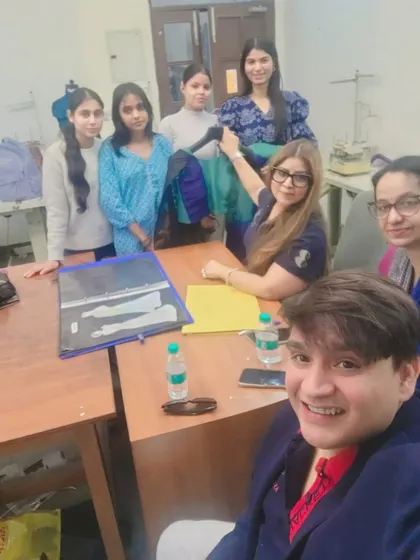 In a portfolio review session with fashion students. A strong portfolio is your entry ticket to the industry. I guide students on how to curate their best work to tell a compelling story about their skills and design philosophy.