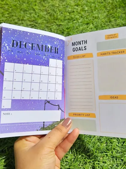 The December page of the planner features a beautiful night sky design, matching the monthly theme.