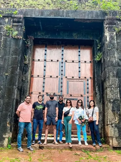 Another team photo at the historic fort gate on the Kodachadri trek, a popular spot to capture the memory of the journey.