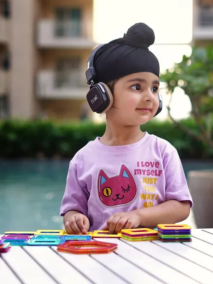 A candid moment from a kids' lifestyle shoot. The focus here is on the child's natural curiosity and expression, creating an authentic image that resonates with parents.