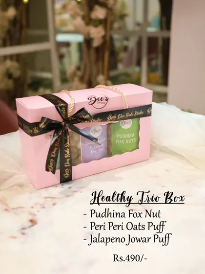 The Healthy Trio Box is for the health-conscious sibling. This gift pack includes three savory snacks: Pudhina Fox Nut, Peri Peri Oats Puff, and Jalapeno Jowar Puff.