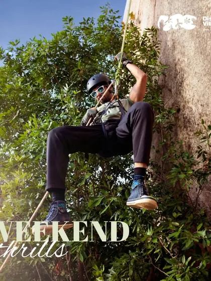 Rappel down a rock face surrounded by lush greenery. This is one of the weekend thrills we offer for those looking to push their boundaries.