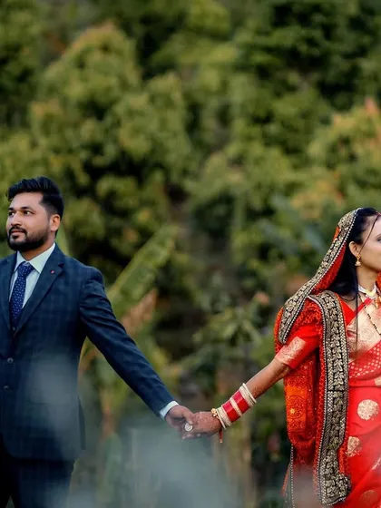 A post-wedding couple shoot in a beautiful natural landscape. The couple is holding hands, looking towards their future, a symbolic shot we love to capture.