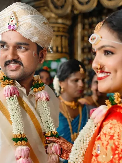 A candid shot of the bride and groom sharing a look during their wedding ceremony. We are always watching for these unposed, connecting moments.