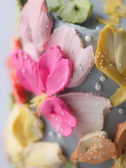 A close-up of the palette knife buttercream flowers, showing the rich texture and vibrant colors.